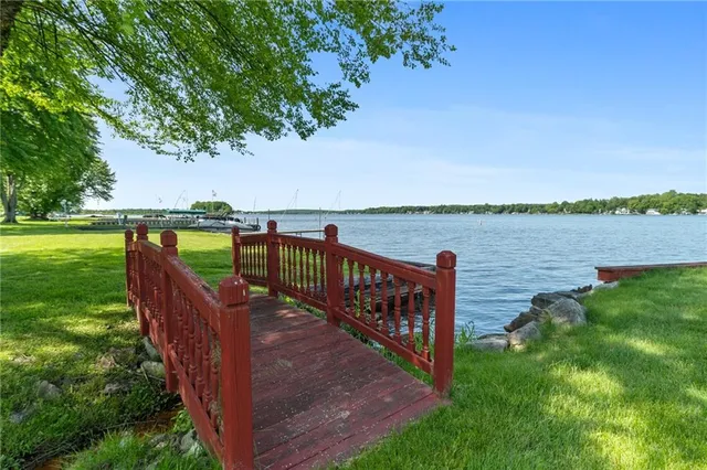 a view of a wooden deck with a yard