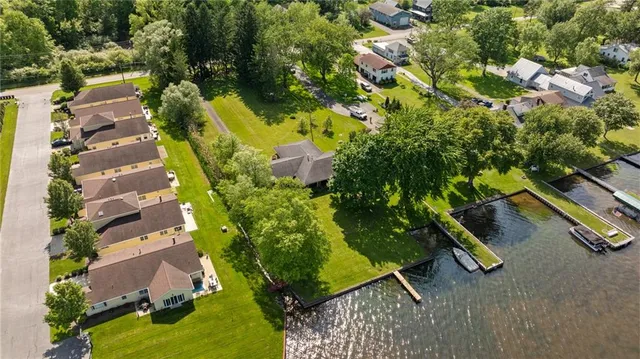 an aerial view of a house with a yard basket ball court and outdoor seating