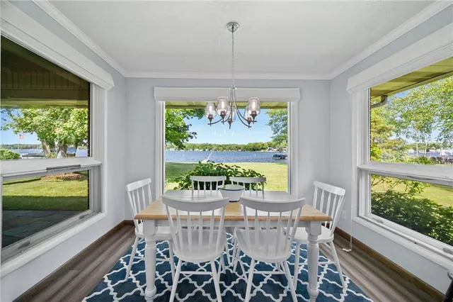 a view of a dining room with furniture window and outside view