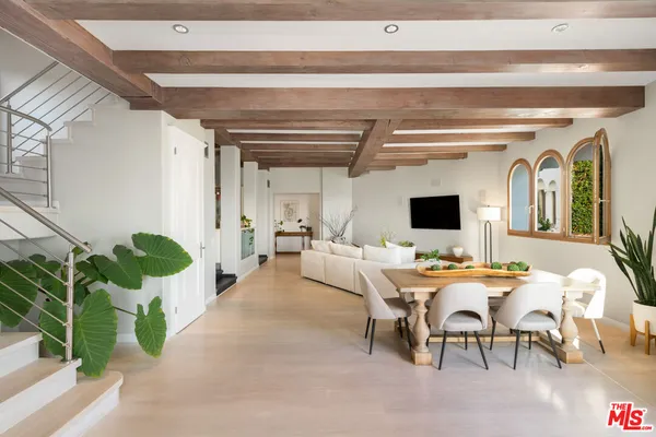 a kitchen with stainless steel appliances a sink stove and refrigerator