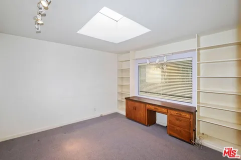 a room with furniture and a window