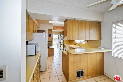 a bathroom with a sink a mirror and a shower