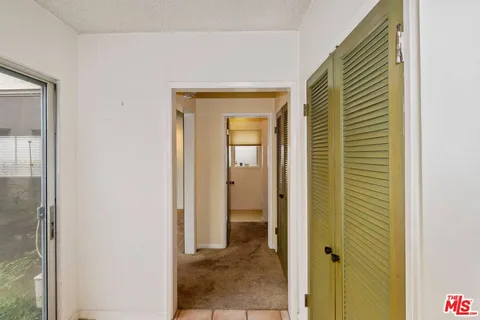 a view of a bathroom from a hallway