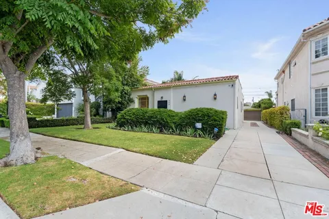 a house view with a garden space