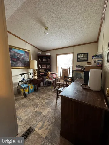 a view of a livingroom with furniture and a livingroom