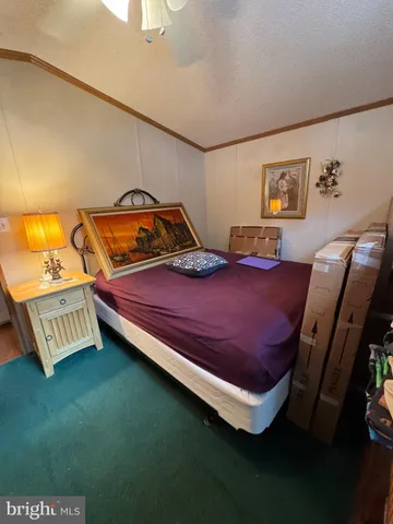 a bed room with a bed and a night stand