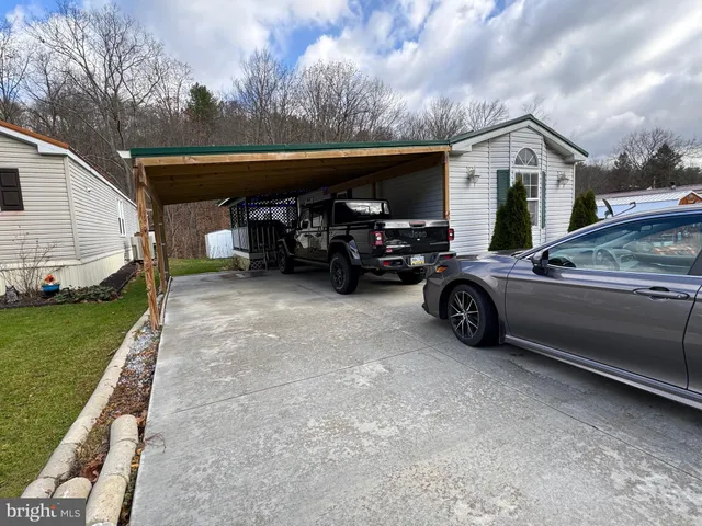 a view of a car parked in front of a house