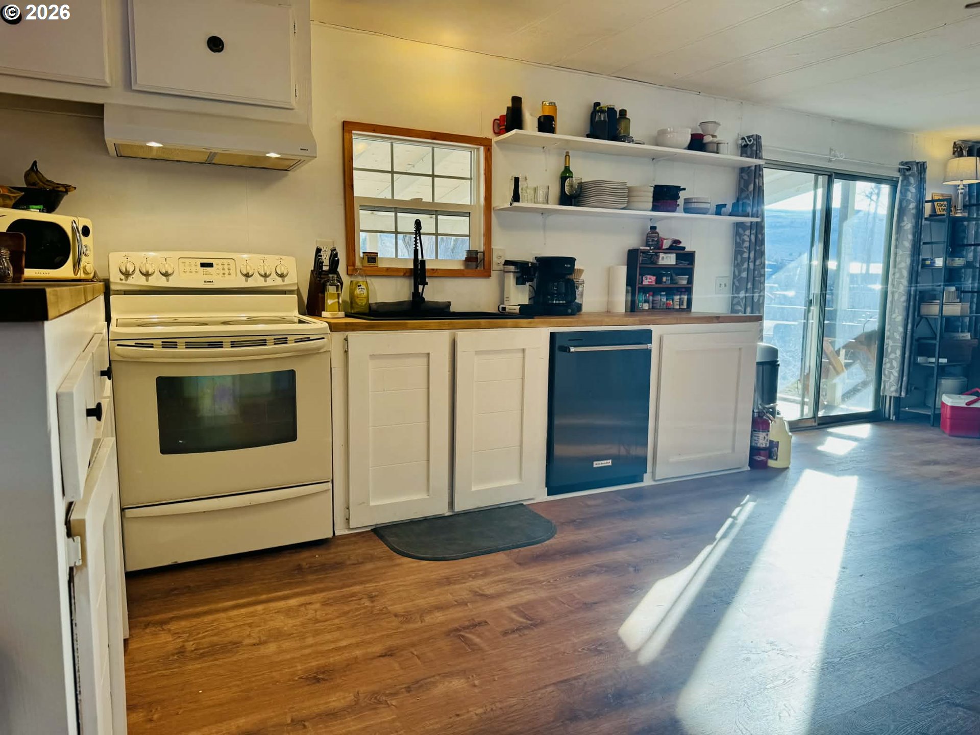 1020 South 2nd Street Union, OR 97883 - Photo 9 of 37 a kitchen with stainless steel appliances a stove a sink and a refrigerator