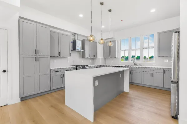 a kitchen with a sink and stove