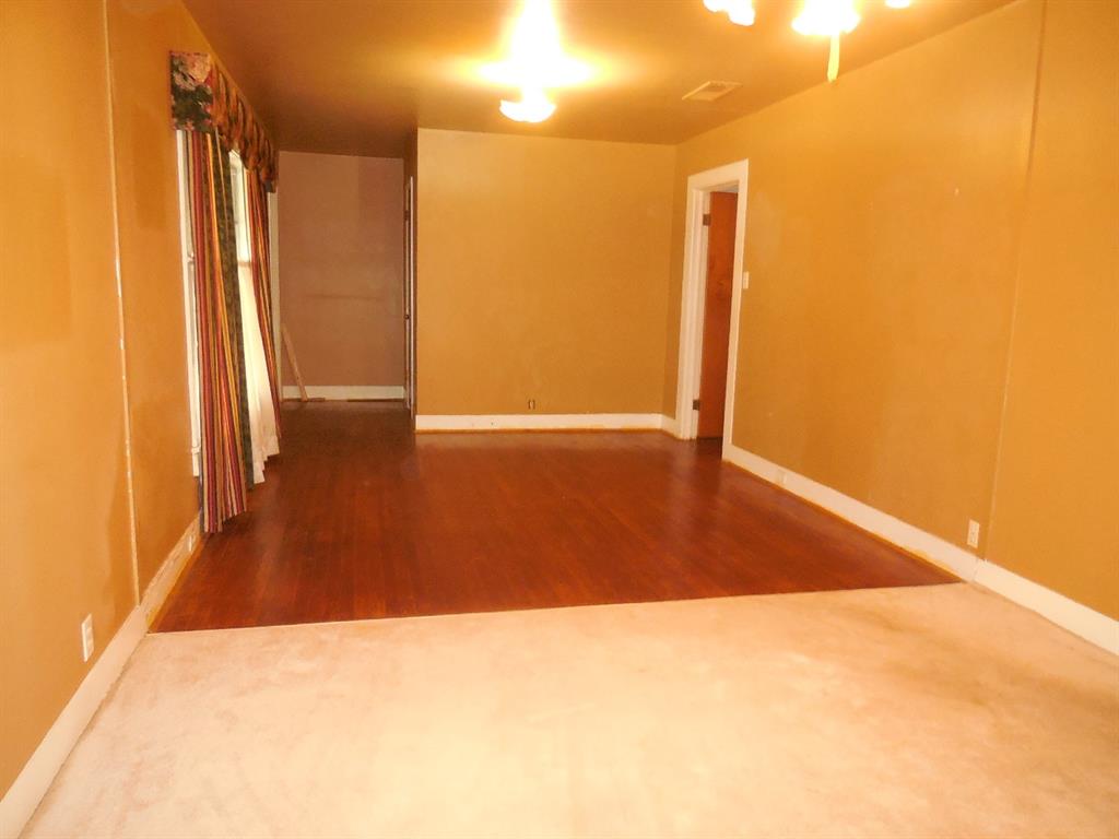 609 West Main Street Ranger, TX 76470 - Photo 11 of 29 a view of empty room with wooden floor