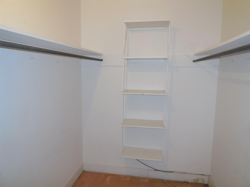 609 West Main Street Ranger, TX 76470 - Photo 12 of 29 a view of an empty walk in closet
