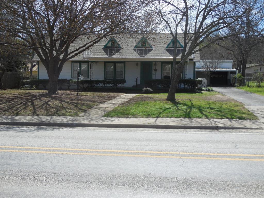 609 West Main Street Ranger, TX 76470 - Photo 27 of 29 front view of a house and a small yard