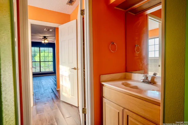 a bathroom with a sink and a mirror