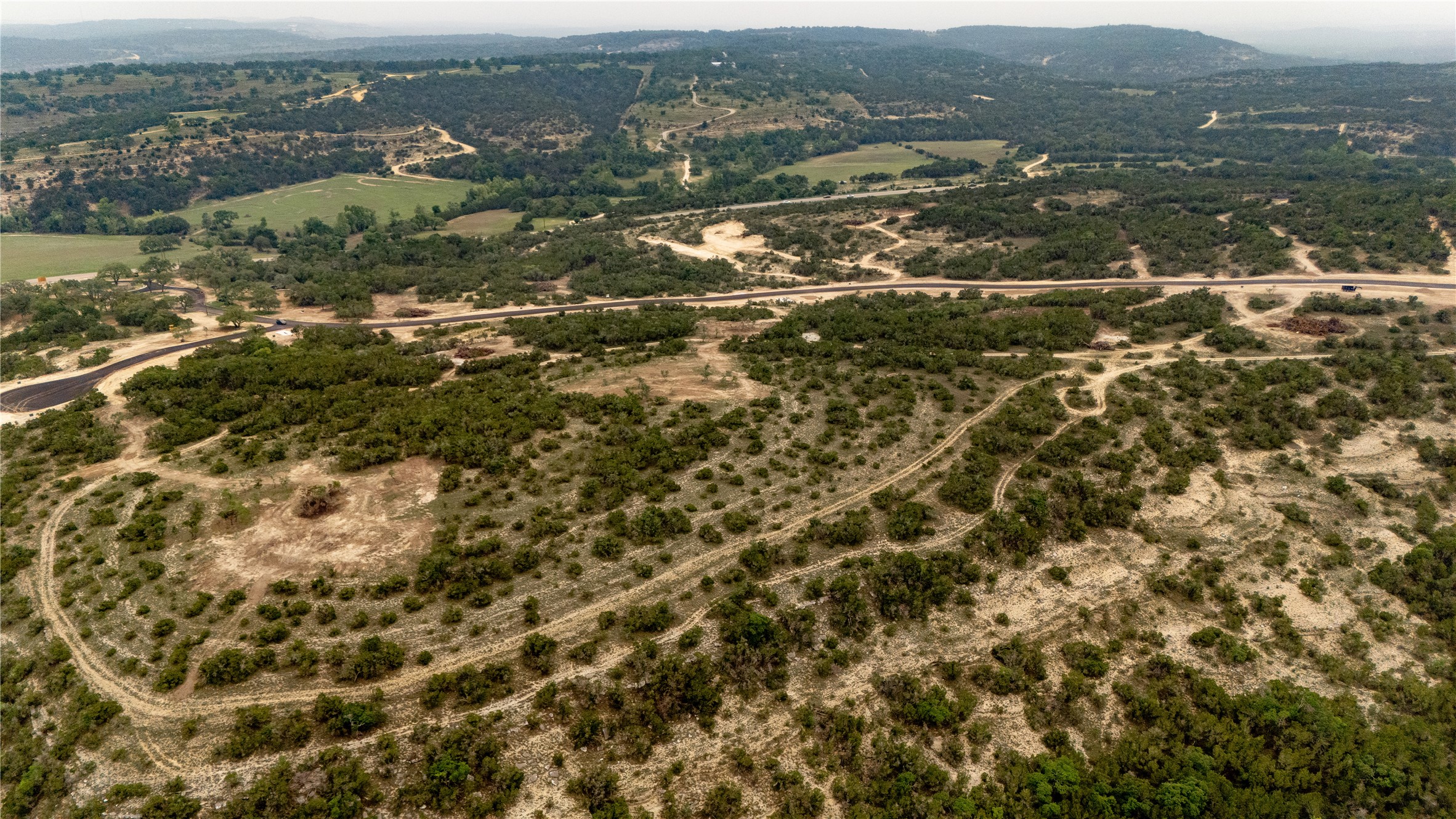 Lot 21 Ranch Road 165 Dripping Springs, TX 78620 - Photo 3 of 8 Expansive acreage featuring mature trees and varied terrain