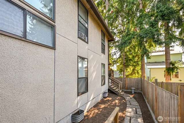 a utility room with sink and mirror