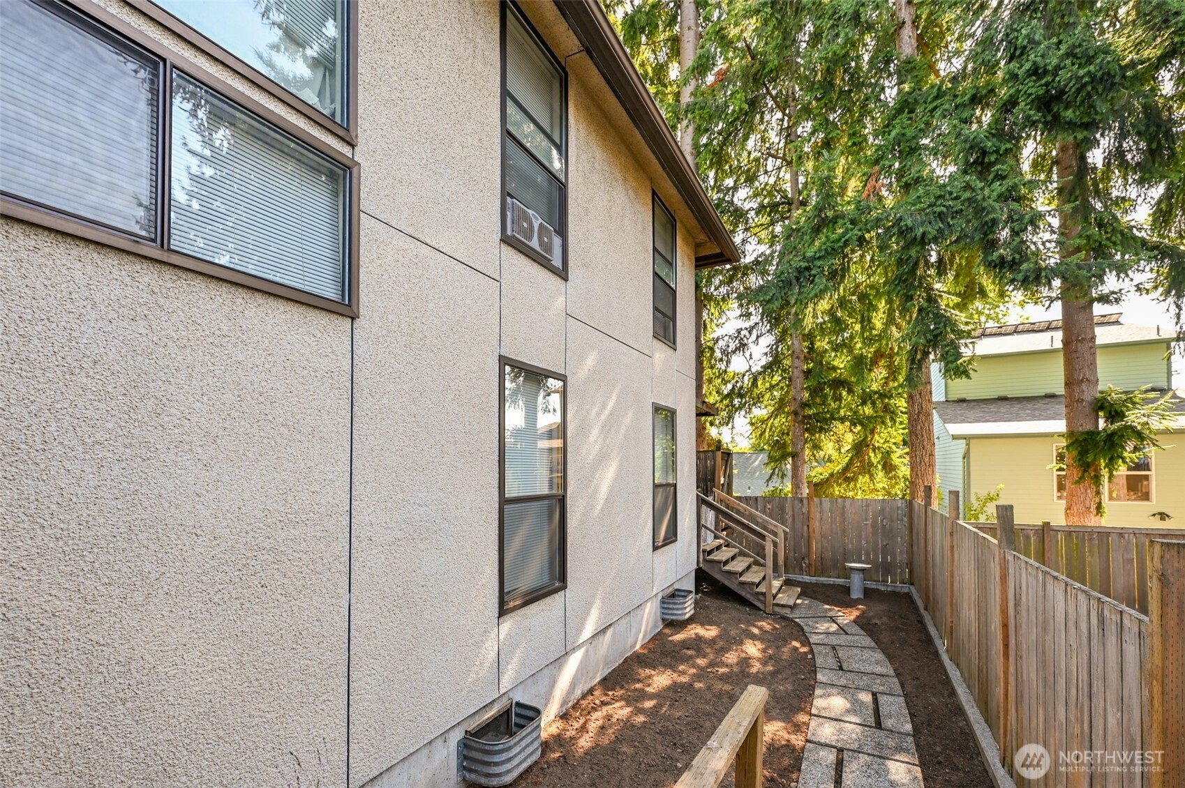 719 North 85th Street Seattle, WA 98103 - Photo 6 of 15 a view of a house with a small yard
