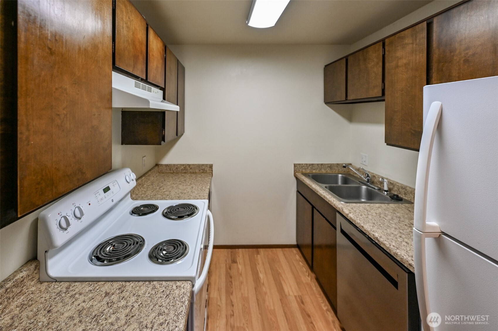 719 North 85th Street Seattle, WA 98103 - Photo 9 of 15 a kitchen with a stove and a microwave