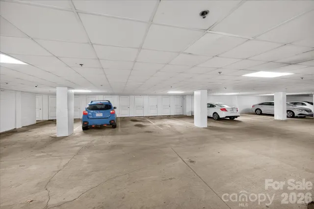 a view of a garage with cars