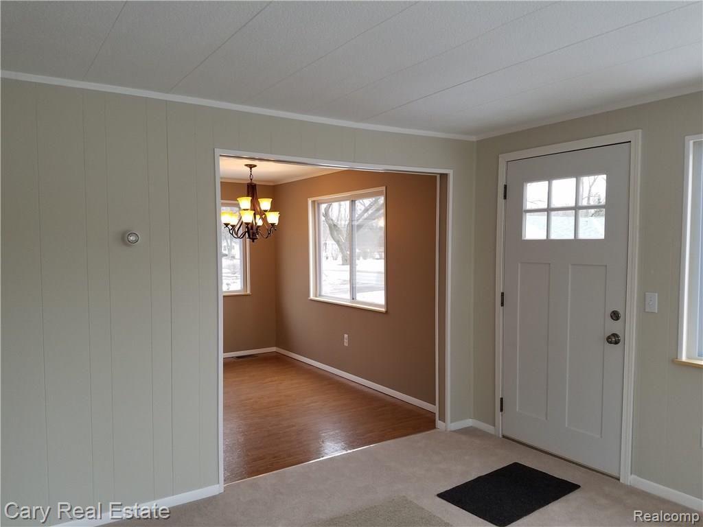 636 West Baker Road Highland, MI 48357 - Photo 10 of 22 Living room open to dining/kitchen
