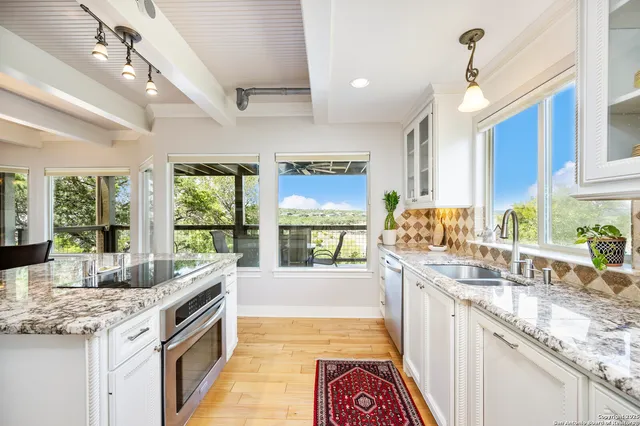 a bedroom with a bed window and a ceiling fan