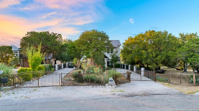 a front view of a house with a yard garage and outdoor seating