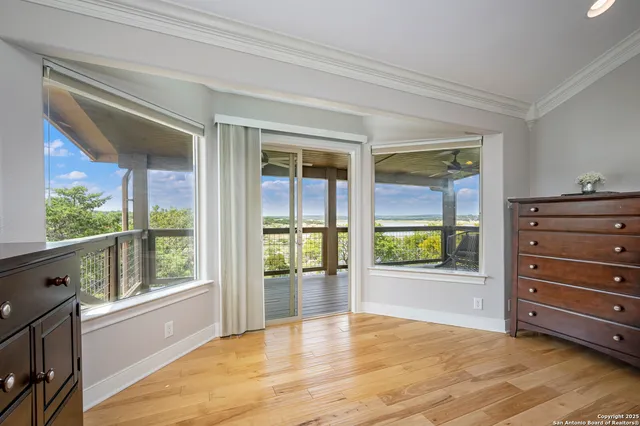 a view of a chairs and table in the balcony