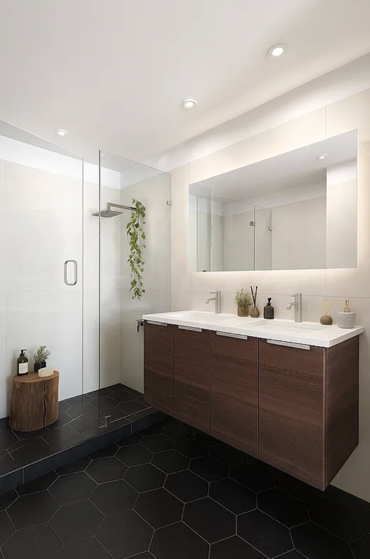 96 16th Street, Unit GARDENA Brooklyn, NY 11215 - Photo 9 of 10 a bathroom with a double vanity sink a mirror and a shower