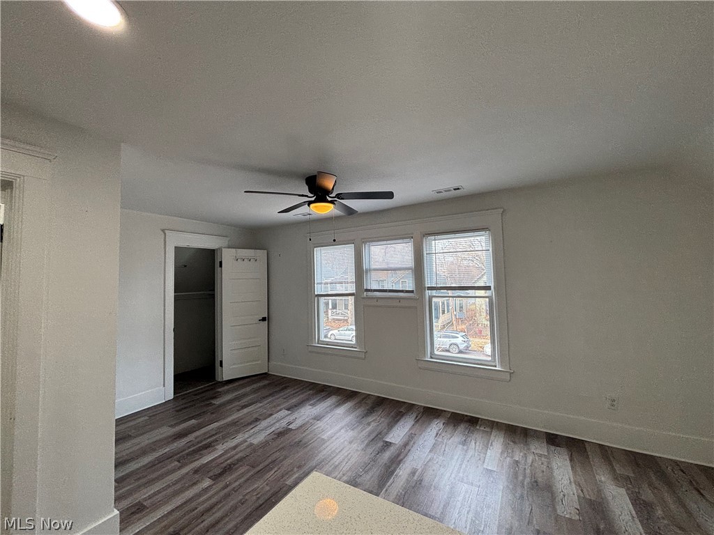 4115 Whitman Avenue, Unit UP Cleveland, OH 44113 - Photo 5 of 12 Unfurnished bedroom with dark wood finished floors, a closet, and ceiling fan