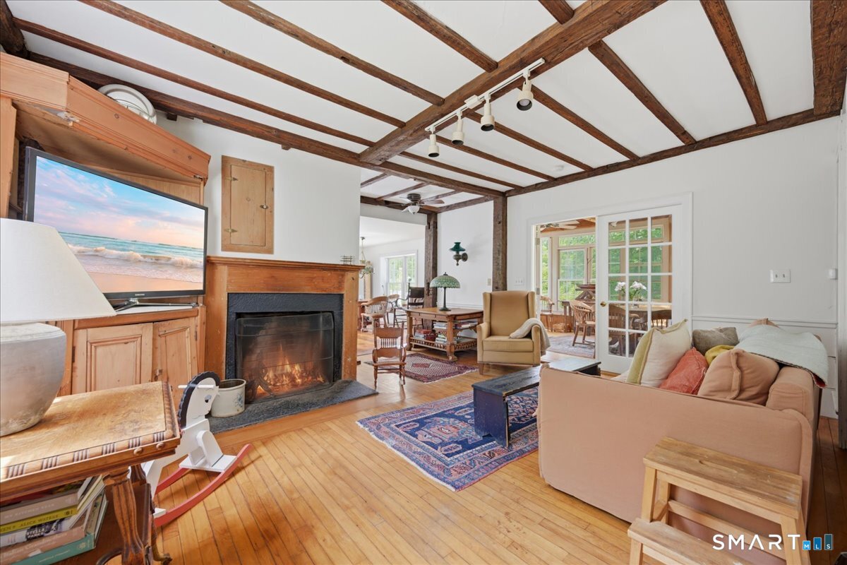 8 Meeting House Road Haddam, CT 06438 - Photo 13 of 40 Family room off the kitchen and enclosed porch