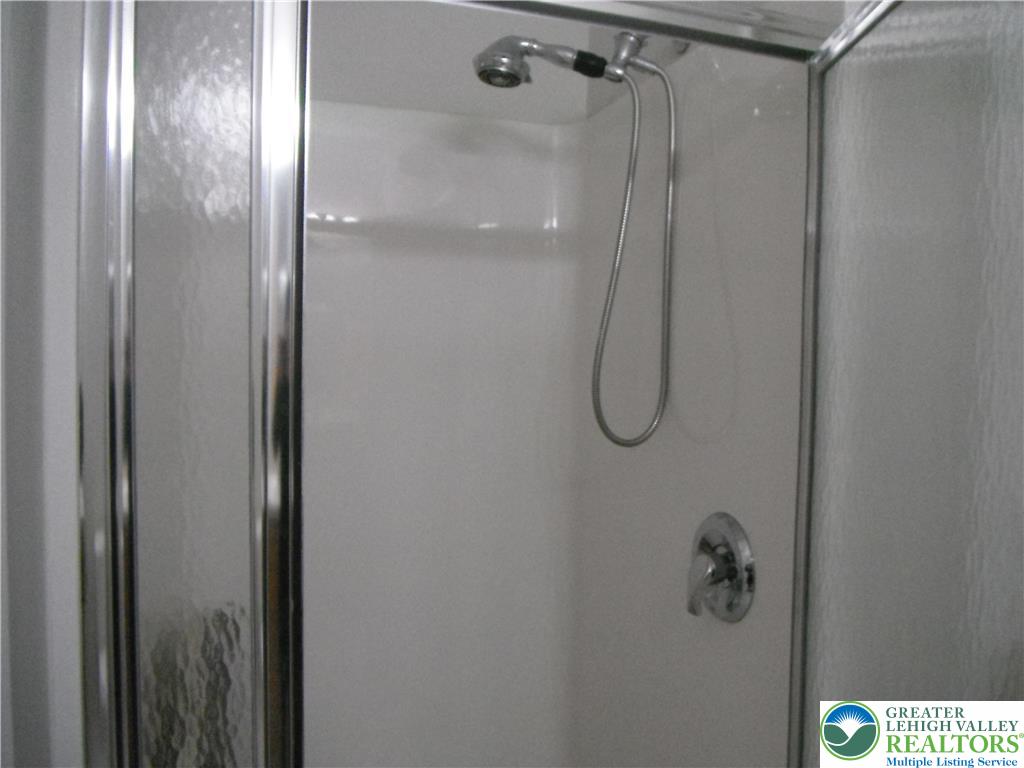 1113 Old Course Lane Easton, PA 18042 - Photo 15 of 26 a bathroom with a glass shower door