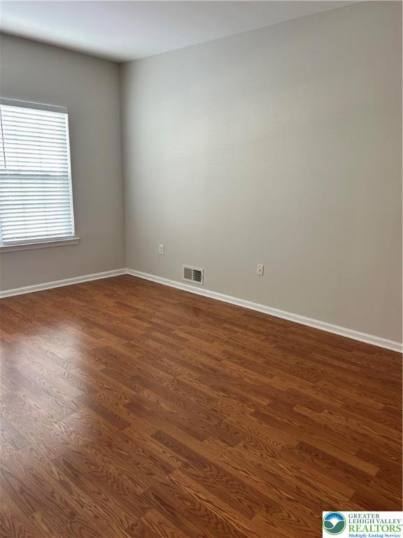 1113 Old Course Lane Easton, PA 18042 - Photo 3 of 26 a view of an empty room with wooden floor and a window