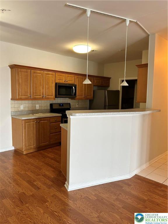 1113 Old Course Lane Easton, PA 18042 - Photo 7 of 26 a kitchen with stainless steel appliances a refrigerator and microwave