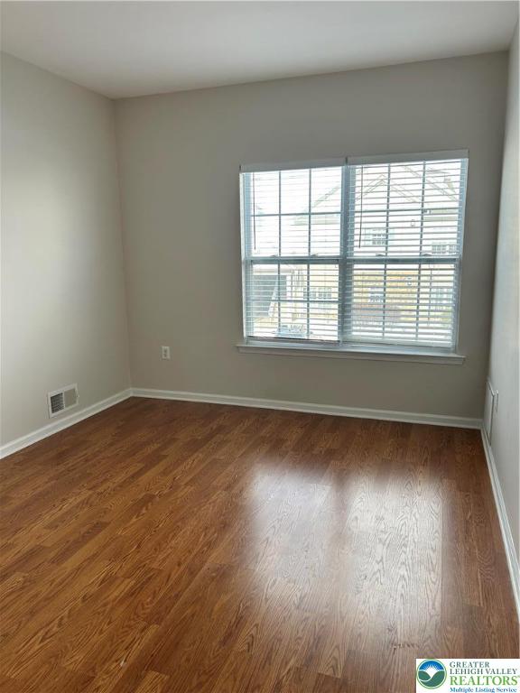 1113 Old Course Lane Easton, PA 18042 - Photo 9 of 26 wooden floor in an empty room with a window