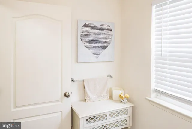 a bathroom with a window and a shower