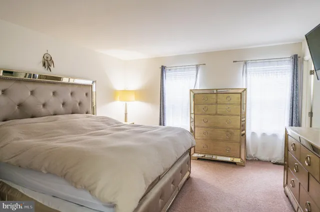 a bedroom with a bed and a cabinets