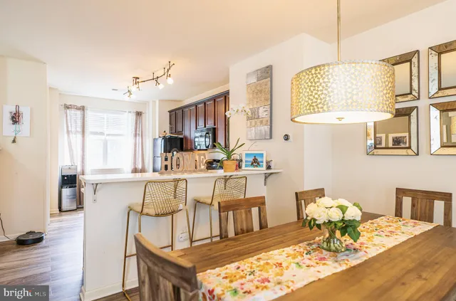 a living room with kitchen island furniture and a table