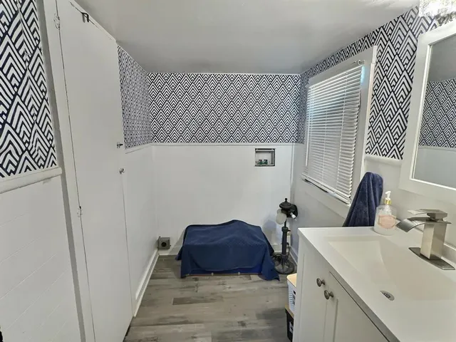 a bathroom with a sink and a mirror