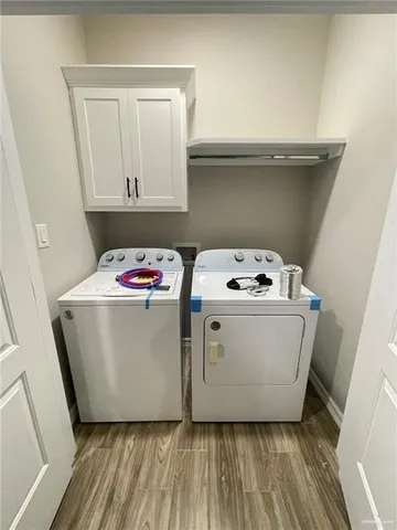 a utility room with washer and dryer