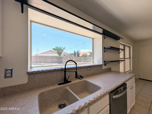 a view of staircase with wooden floor and white walls