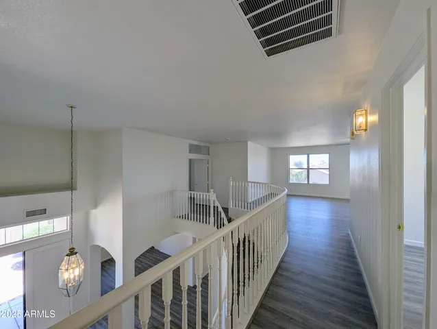 a view of swimming pool from a lounge chair