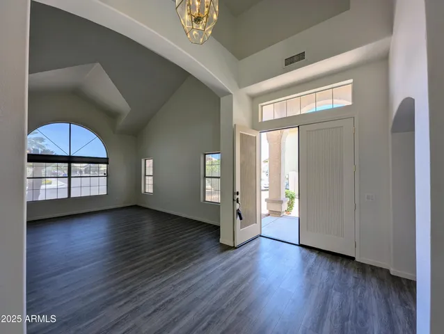 a kitchen with a stove a sink and a refrigerator