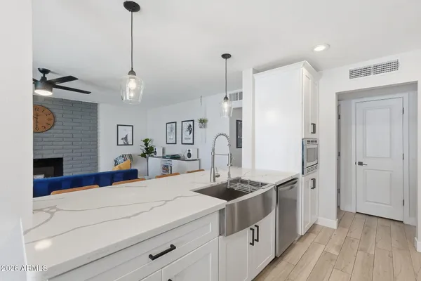 a kitchen with stainless steel appliances a stove and a refrigerator