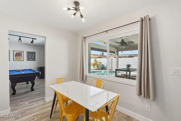 a kitchen with stainless steel appliances a stove a sink and a refrigerator