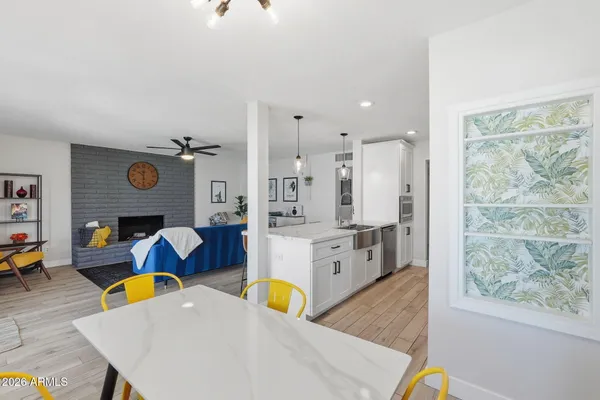 a dining room with furniture and window