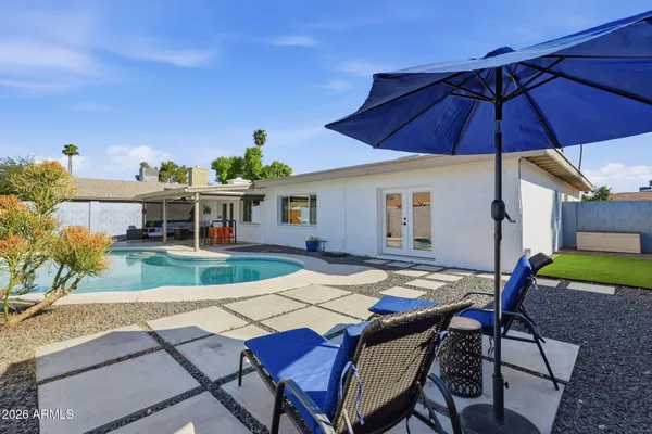 a view of a swimming pool with a patio