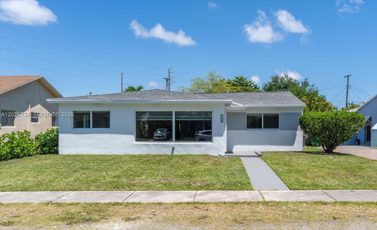 266 Southwest 6th Street Dania Beach, FL 33004 - Photo 1 of 37 a view of a house with garden and yard