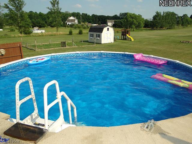 5380 Seville Road Seville, OH 44273 - Photo 13 of 17 Take advantage of the above ground pool on those hot summer days, right in your back yard!