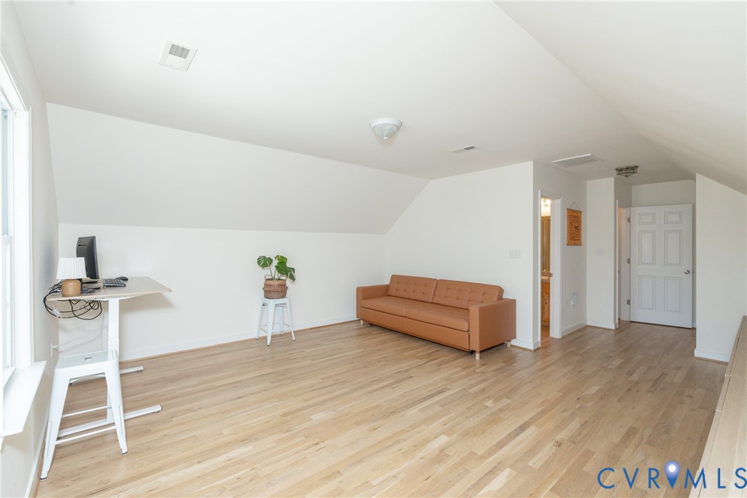 15618 Rowlett Road Chesterfield, VA 23838 - Photo 19 of 29 a room with furniture and a wooden floor