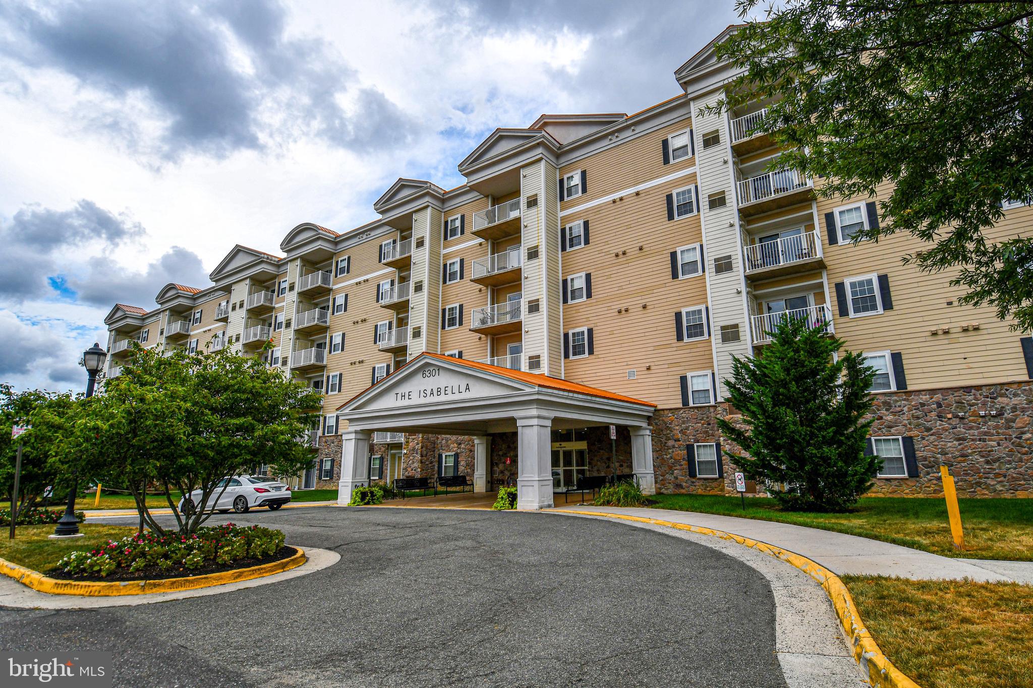 6301 Edsall Road, Unit 115 Alexandria, VA 22312 - Photo 1 of 37 a front view of a building with garden