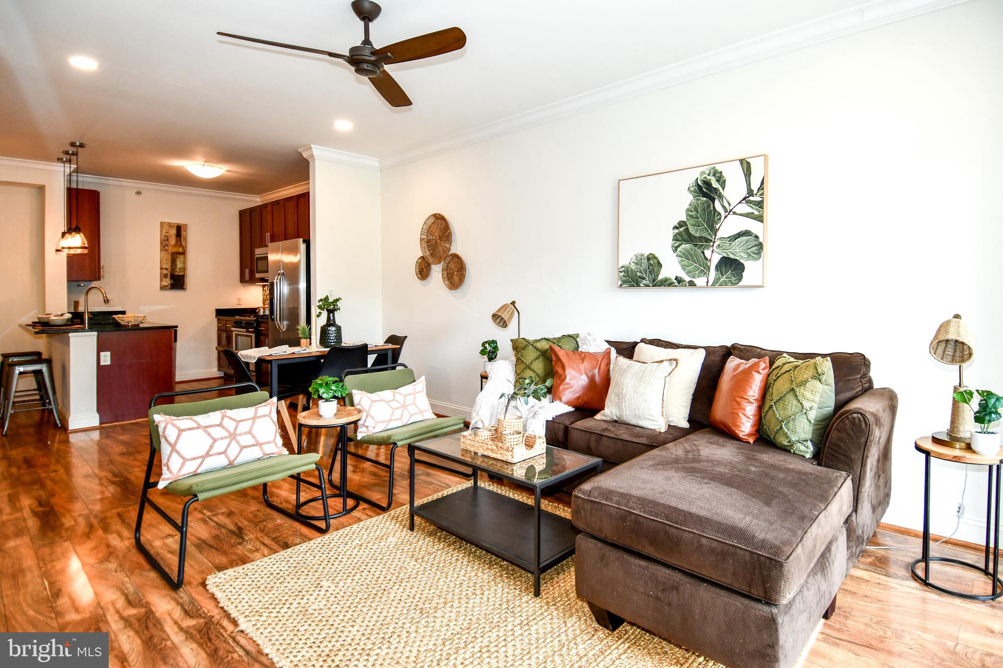 6301 Edsall Road, Unit 115 Alexandria, VA 22312 - Photo 12 of 37 a living room with furniture and wooden floor